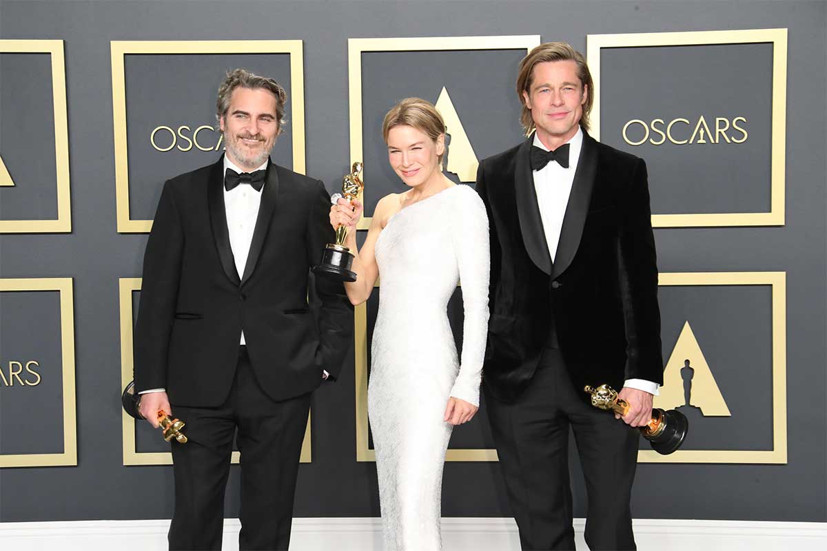 Oscar winners Joaquin Phoenix, Renee Zellweger, and Brad Pitt after winning their awards at the 2020 Oscars ceremony.