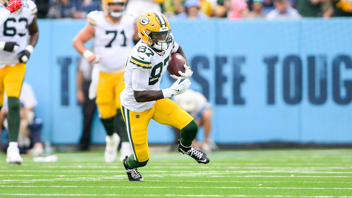 Green Bay Packers wide receiver Romeo Doubs (87) makes a catch and runs the ball against the Tennessee Titans during the first half at Nissan Stadium