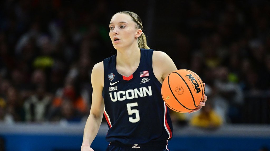 Connecticut Huskies guard Paige Bueckers (5) dribbles the ball against the Iowa Hawkeyes in the semifinals of the Final Four of the womens 2024 NCAA Tournament at Rocket Mortgage FieldHouse.
