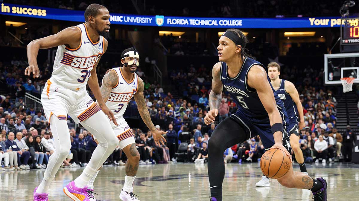 Orlando Magic forward Paolo Banchero (5) moves to the basket guarded by Phoenix Suns forward Kevin Durant (35) in the third quarter at the Kia Center.