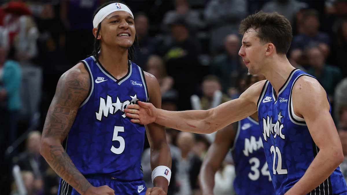 Orlando Magic forward Paolo Banchero (5) reacts with forward Franz Wagner (22) after making a shot against the Utah Jazz in the fourth quarter at the Delta Center.