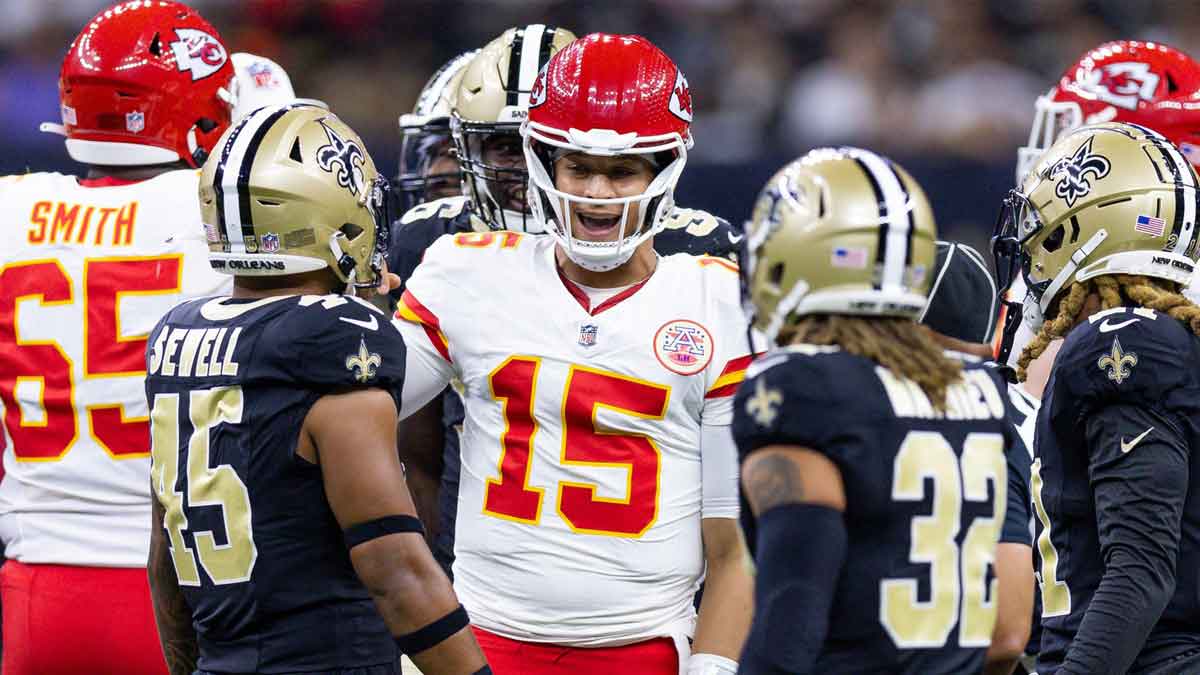 Aug 13, 2023; New Orleans, Louisiana, USA; Kansas City Chiefs quarterback Patrick Mahomes (15) talks to New Orleans Saints linebacker Nephi Sewell (45) and safety Tyrann Mathieu (32) after being tackled during the first half at the Caesars Superdome. Mandatory Credit: Stephen Lew-Imagn Images