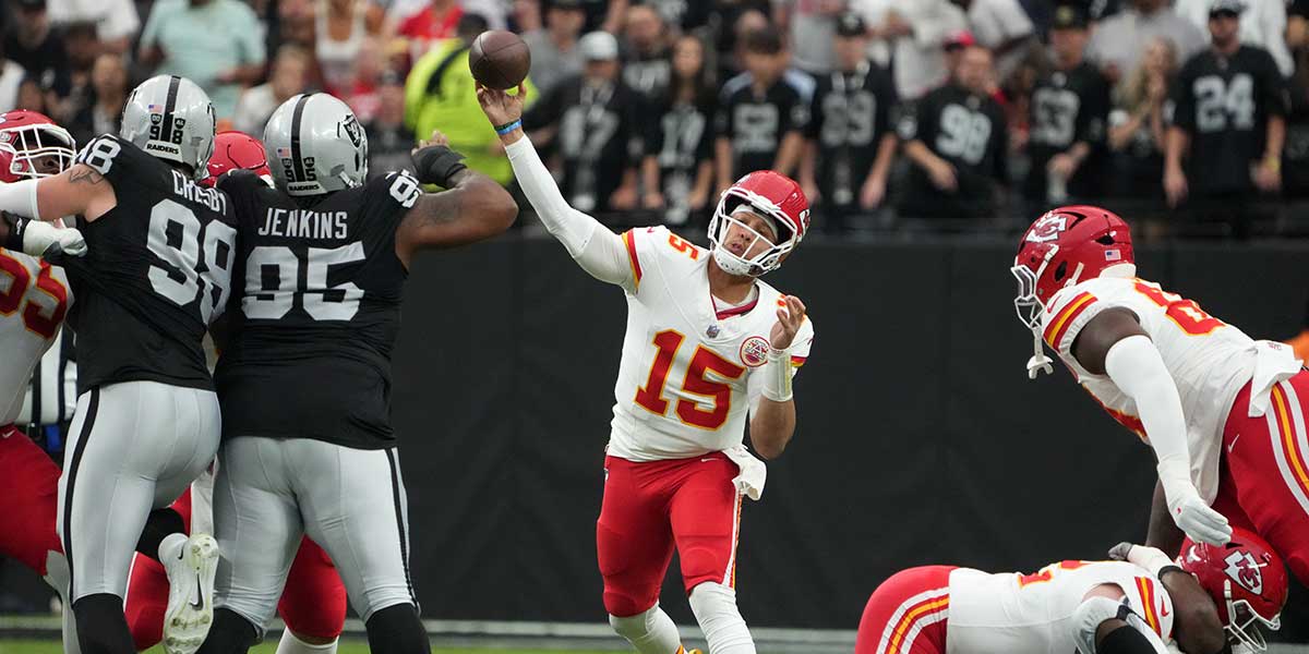 Kansas City Chiefs quarterback Patrick Mahomes (15) throws the ball against the Las Vegas Raiders in the first half at Allegiant Stadium.