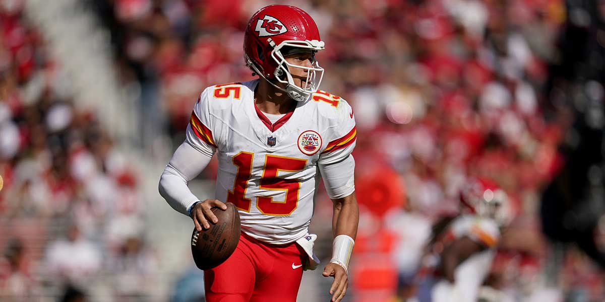 Kansas City Chiefs quarterback Patrick Mahomes (15) runs with the ball against the San Francisco 49ers in the second quarter at Levi's Stadium.