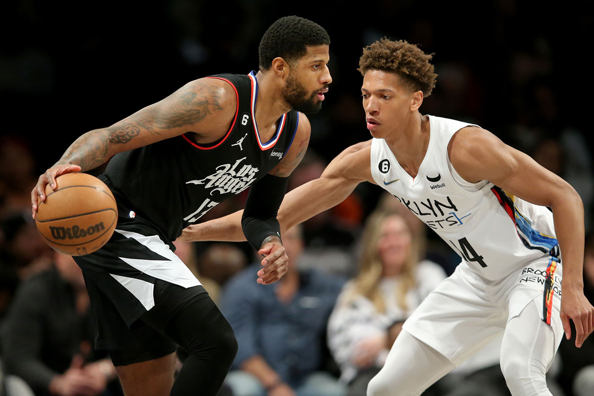 Los Angeles Lakers guard Russell Westbrook (0) puts up a shot around Miami Heat forward Jimmy Butler (22) during the first half at FTX Arena.