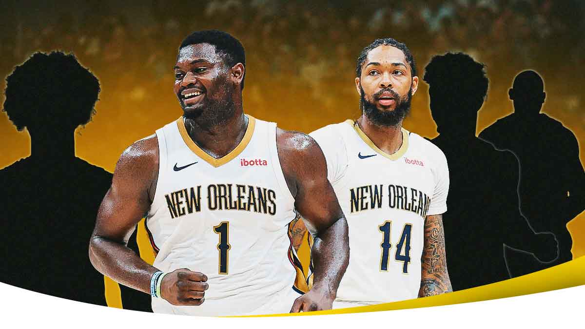 Pelicans players Brandon Ingram and Zion Williamson looking at each other.
