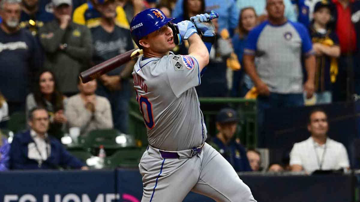 Oct 3, 2024; Milwaukee, Wisconsin, USA; New York Mets first baseman Pete Alonso (20) hits a three run home run against the Milwaukee Brewers in the ninth inning during game three of the Wildcard round for the 2024 MLB Playoffs at American Family Field. 