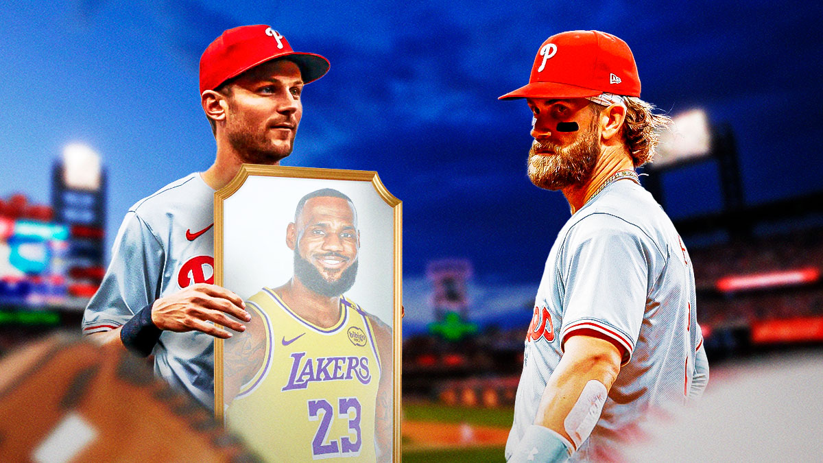 Phillies' Trea Turner holding up a mirror in front of Bryce Harper, with LeBron James as the reflection on the mirror