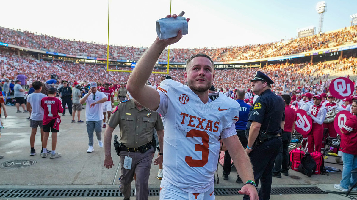 Texas Longhorns quarterback Quinn Ewers (3) wavies to Oklahoma Sooners fans as he walks off the field after a win over 34-3 in the Red River Rivalry Football Game at the Cotton Bowl Stadium in Dallas, TX on Saturday Oct. 12, 2024.