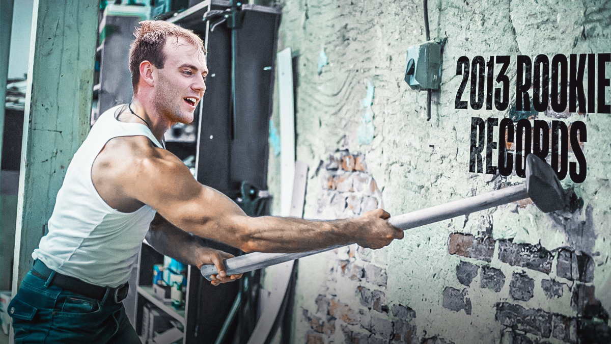 Raiders Brock Bowers with a sledge hammer smashing a glass plate that says "2013 Rookie Records"