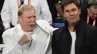 Las Vegas Aces owner Mark Davis and part-owner Tom Brady talk before the game between the Las Vegas Aces and the New York Liberty during game one of the 2023 WNBA Finals at Michelob Ultra Arena