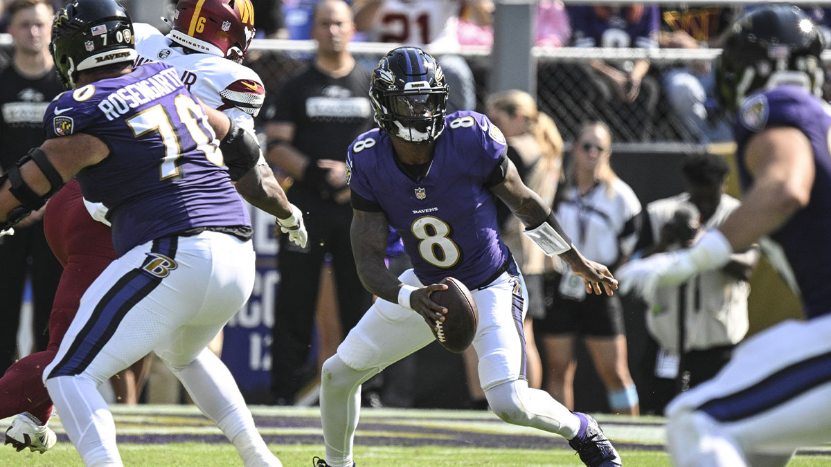 Baltimore Ravens quarterback Lamar Jackson (8) looks to run during the first quarter against the Washington Commanders at M&T Bank Stadium