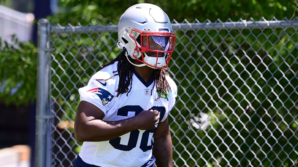 New England Patriots running back Rhamondre Stevenson (38) walks to the practice fields for minicamp at Gillette Stadium.