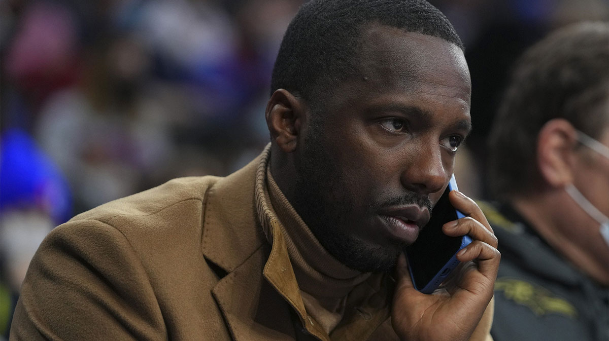 NBA agent Rich Paul talks on the phone prior to the game between the Charlotte Hornets and Philadelphia 76ers at the Wells Fargo Center.