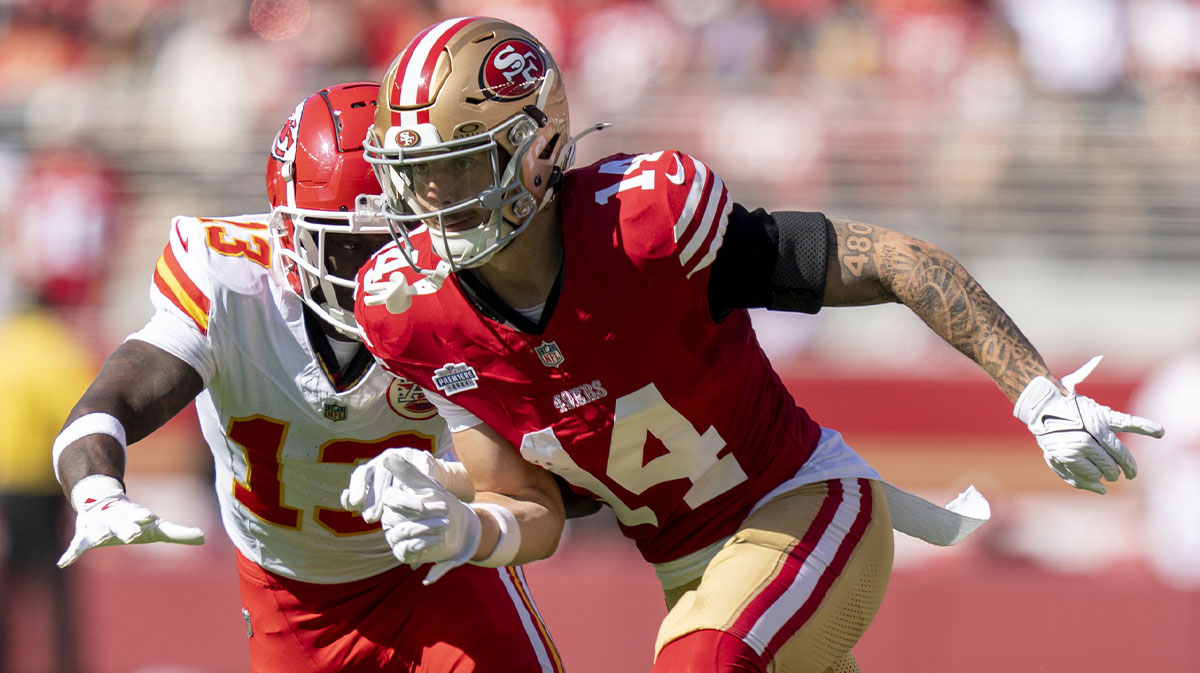 San Francisco 49ers wide receiver Ricky Pearsall (14) runs against Kansas City Chiefs safety Nazeeh Johnson (13) during the first quarter at Levi's Stadium.