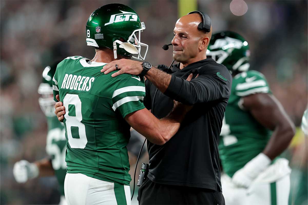 Sep 19, 2024; East Rutherford, New Jersey, USA; New York Jets head coach Robert Saleh hugs quarterback Aaron Rodgers (8) after a touchdown by running back Breece Hall (not pictured) during the second quarter against the New England Patriots at MetLife Stadium.