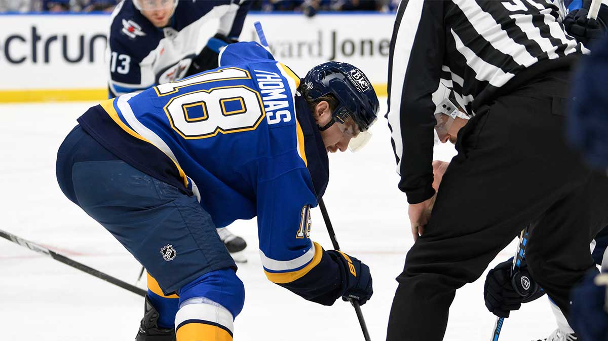 St. Louis Blues center Robert Thomas (18) takes a face-off against the Winnipeg Jets during the first period at Enterprise Center.