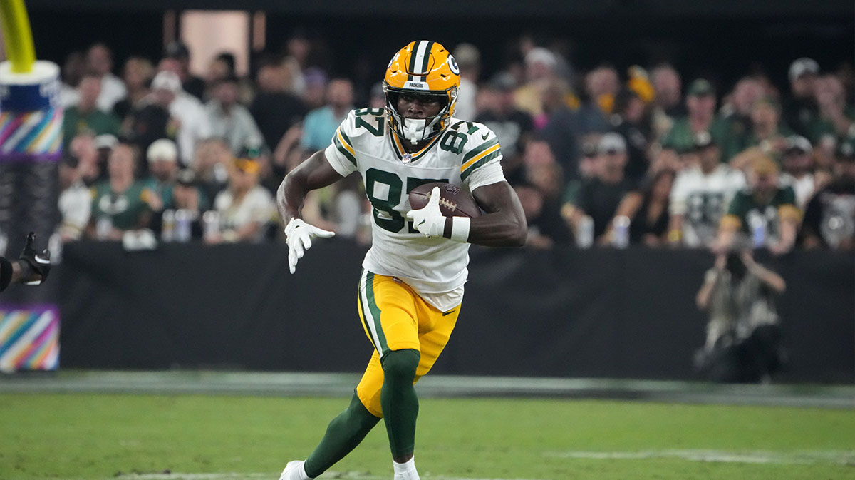Green Bay Packers wide receiver Romeo Doubs (87) carries the ball against the Las Vegas Raiders in the second half at Allegiant Stadium.