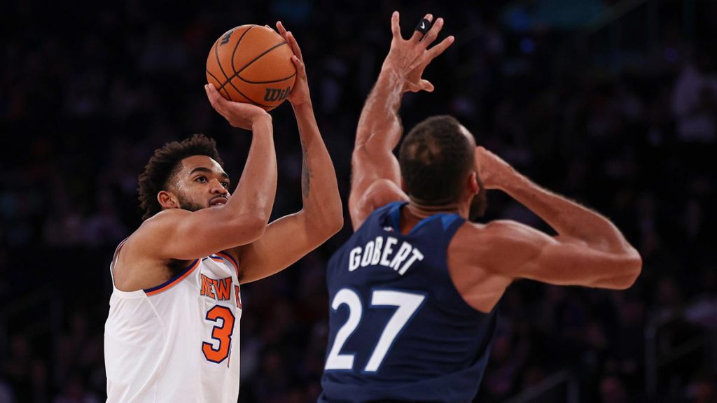New York Knicks center Karl-Anthony Towns (32) shoots the ball asMinnesota Timberwolves center Rudy Gobert (27) defends during the first half at Madison Square Garden.
