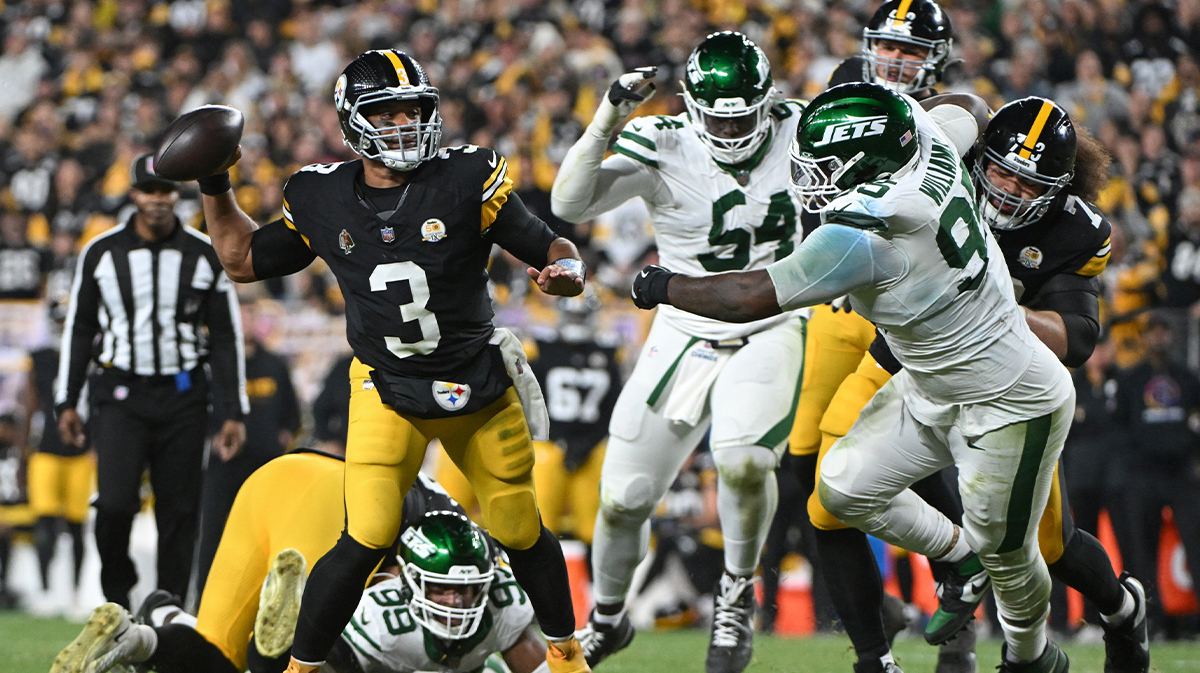 Pittsburgh Steelers quarterback Russell Wilson (3) throws pass while being pressured by New York Jets defensive tackle Quinnen Williams (95) during the second quarter at Acrisure Stadium.