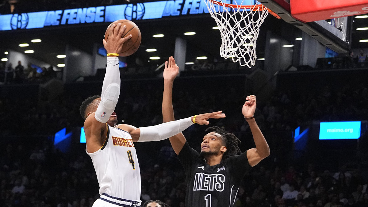 Denver Nuggets point guard Russell Westbrook (4) shoots a layup against Brooklyn Nets forward Ziaire Williams (1) during the first half at Barclays Center.