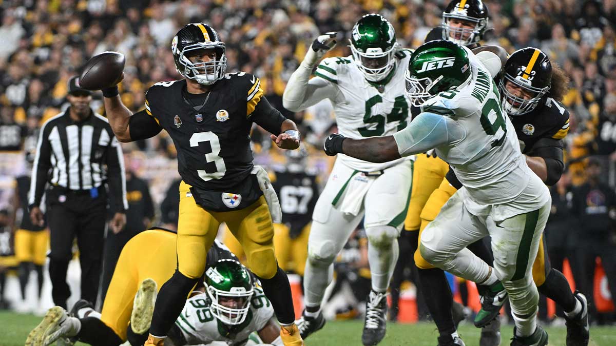 Oct 20, 2024; Pittsburgh, Pennsylvania, USA; Pittsburgh Steelers quarterback Russell Wilson (3) throws pass while being pressured by New York Jets defensive tackle Quinnen Williams (95) during the second quarter at Acrisure Stadium.