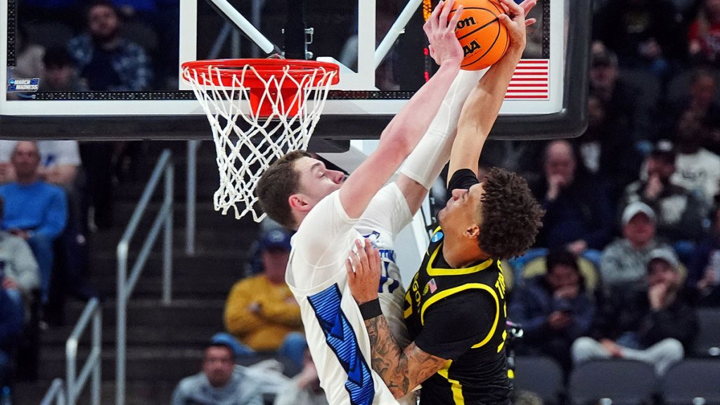 Creighton Bluejays center Ryan Kalkbrenner (11) blocks a shot of Oregon Ducks guard Jadrian Tracey (22) during the second half in the second round of the 2024 NCAA Tournament at PPG Paints Arena. 