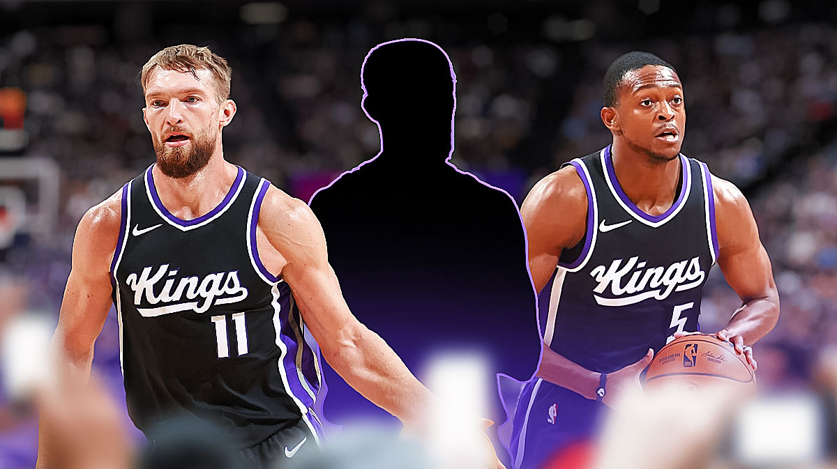 Kings' De'Aaron Fox with Domantas Sabonis and blacked out player