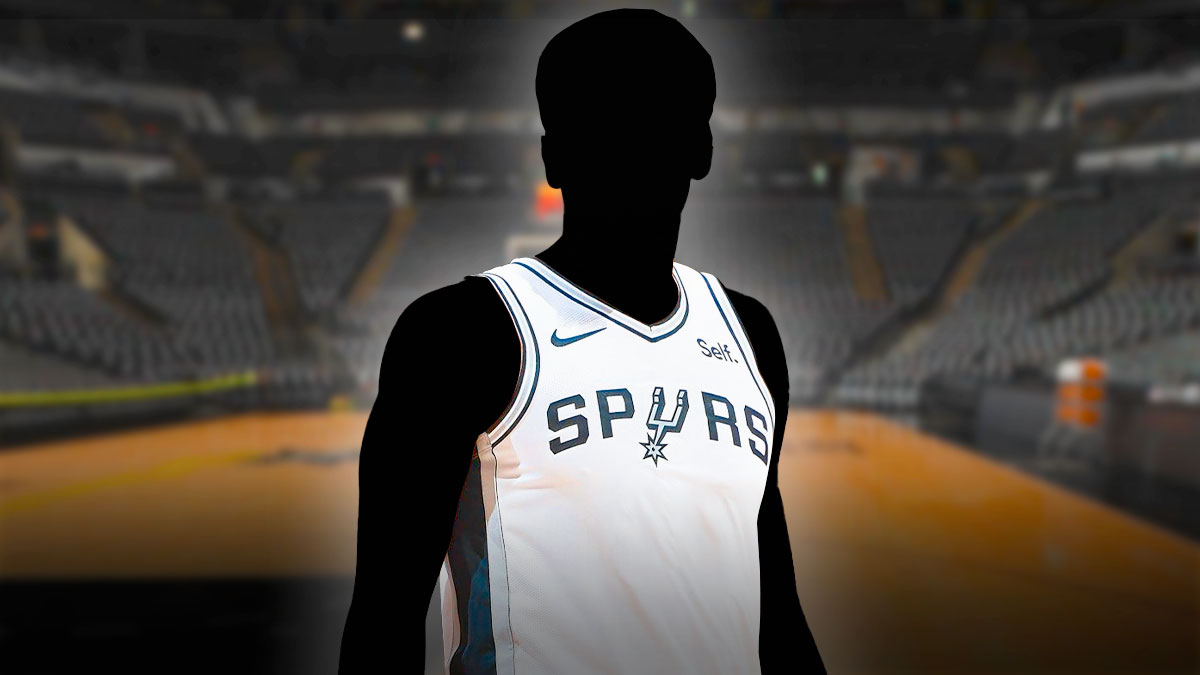 A shadowy player in a San Antonio Spurs jersey with the Spurs arena in the background, two-way contract roster