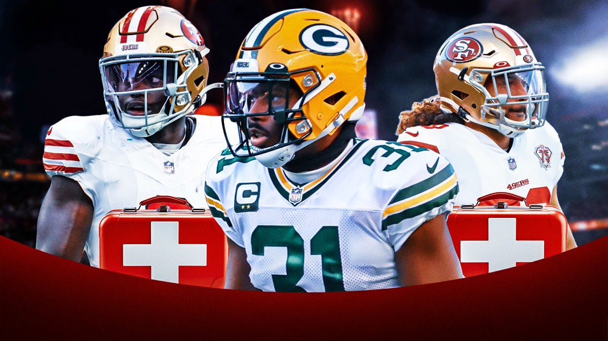 Packers Adrian Amos (center) next to 49ers Talanoa Hufanga with a first aid kit (left) and 49ers Malik Mustapha with a first aid kit (right)