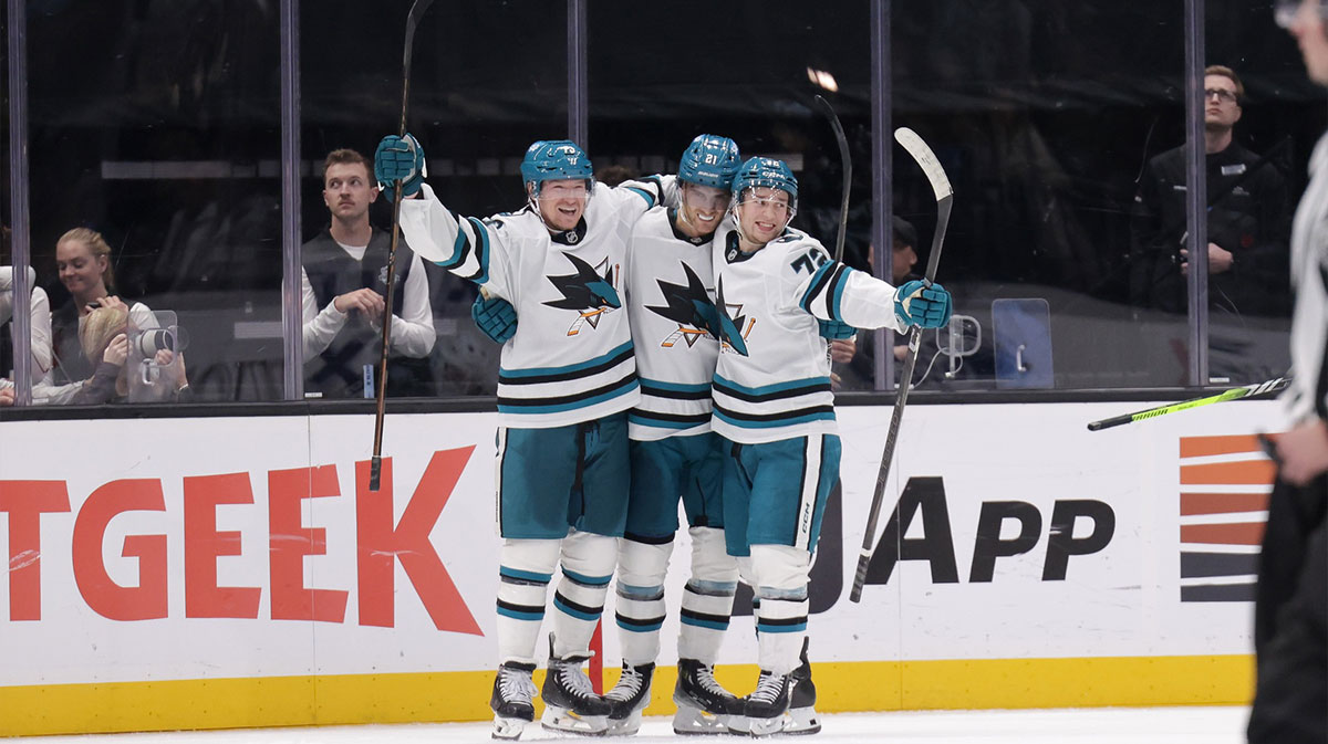 San Jose Sharks center Alexander Wennberg (21) celebrates with teammates after scoring the game winning goal during over-time against the Utah Hockey Club at Delta Center.