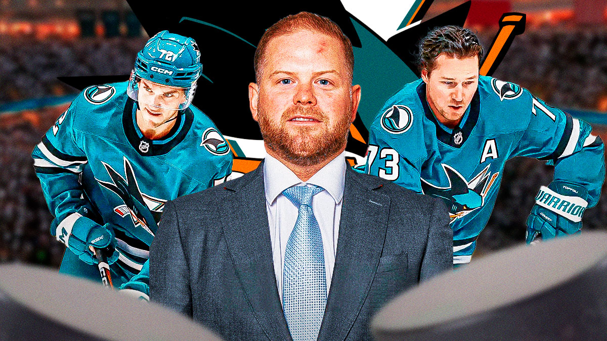 Ryan Warsofsky in middle looking stern, Tyler Toffoli and William Eklund on either side, San Jose Sharks logo, hockey rink in background