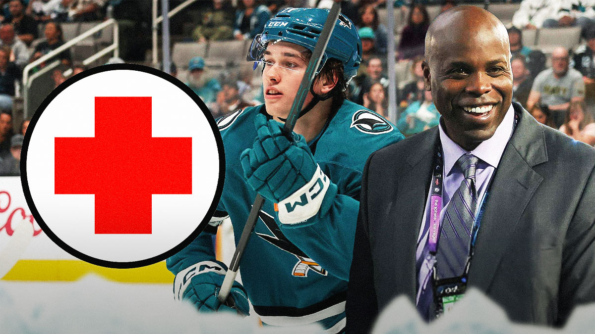 Sharks top draft pick Macklin Celebrini and Sharks GM Mike Grier with a red medical cross