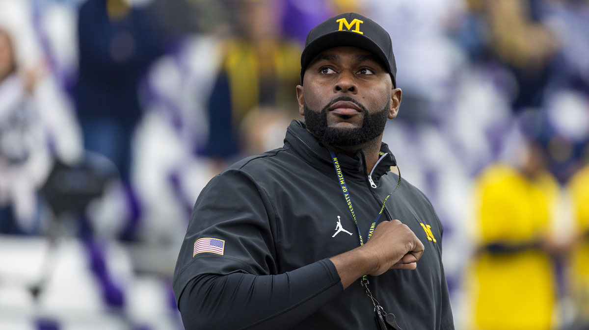 Michigan Wolverines head coach Sherrone Moore walks out of the locker room during pregame warmups against the Washington Huskies at Alaska Airlines Field at Husky Stadium.