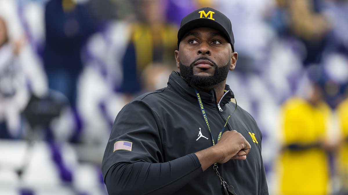 Michigan Wolverines head coach Sherrone Moore walks out of the locker room during pregame warmups against the Washington Huskies at Alaska Airlines Field at Husky Stadium.
