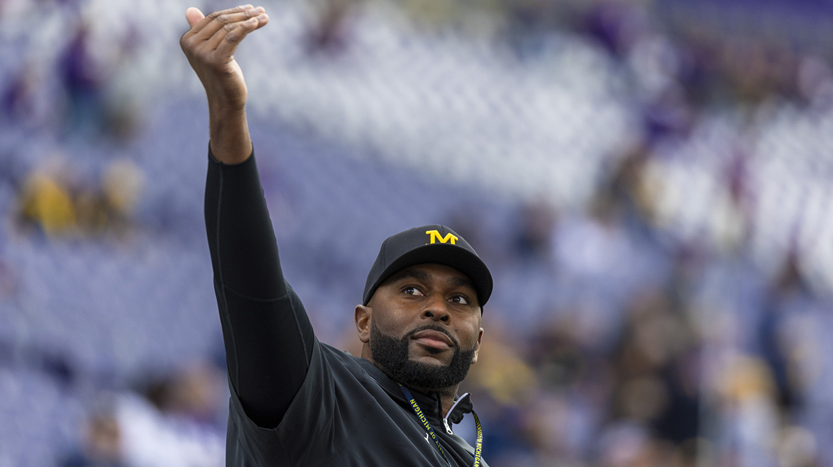 Michigan Wolverines head coach Sherrone Moore walks out of the locker room during pregame warmups against the Washington Huskies at Alaska Airlines Field at Husky Stadium.