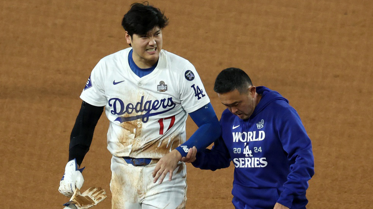 Los Angeles Dodgers designated hitter Shohei Ohtani (17) walks off the field after injuring his shoulder against the New York Yankees in the seventh inning for game two of the 2024 MLB World Series at Dodger Stadium.