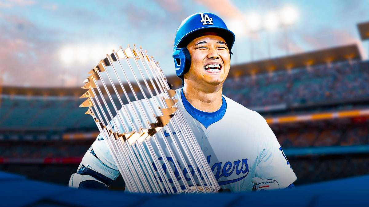 Dodgers' Shohei Ohtani smiling while holding the World Series trophy
