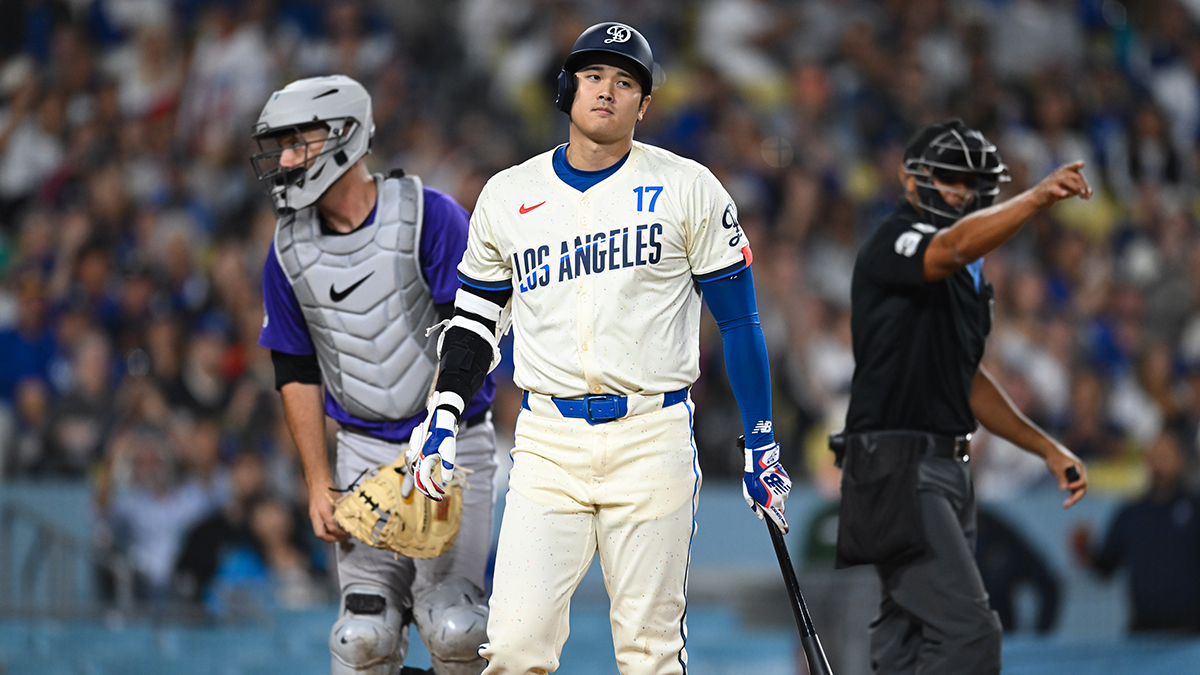 Los Angeles Dodgers designated hitter Shohei Ohtani (17) reacts after being struck by a pitch against the Colorado Rockies during the sixth inning at Dodger Stadium.