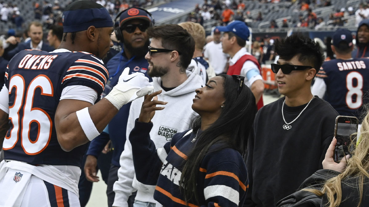 Chicago Bears safety Jonathan Owens (36) and his wife olympian Simone Biles before the game against the Los Angeles Rams at Soldier Field