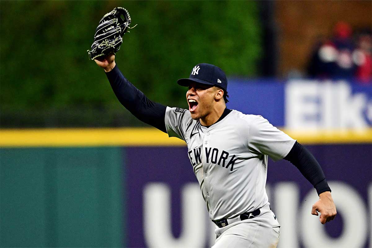 New York Yankees outfielder Juan Soto (22) celebrates after making the final out to beat the Cleveland Guardians during game five of the ALCS for the 2024 MLB playoffs at Progressive Field.