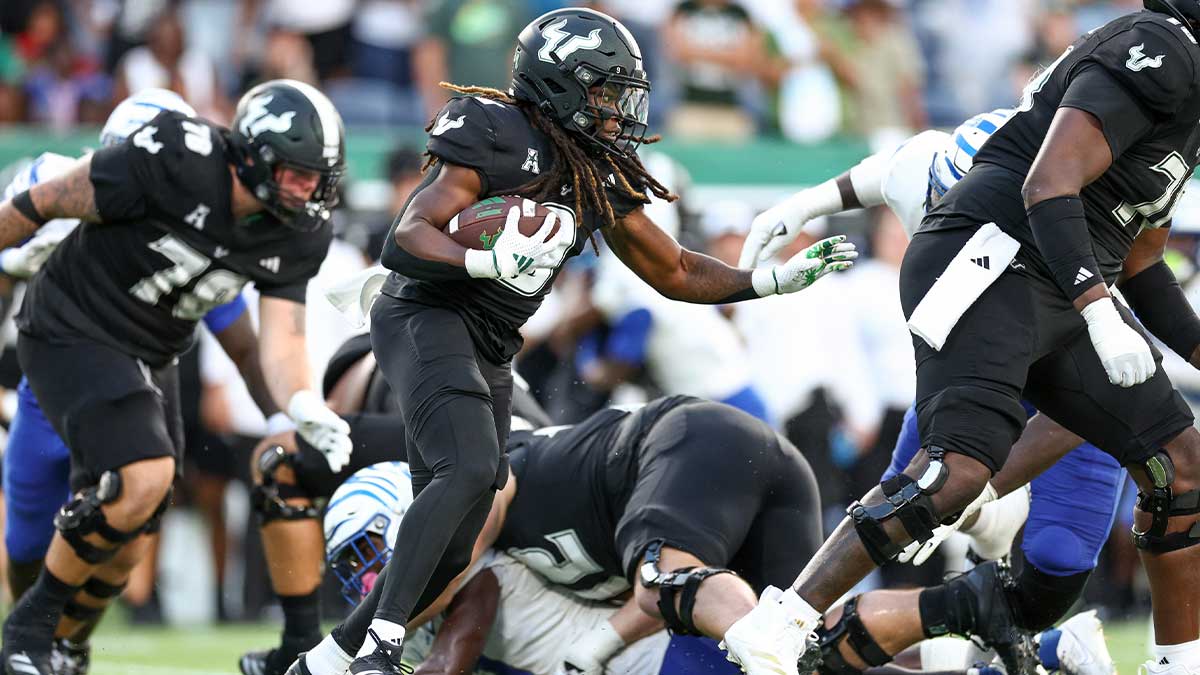 South Florida Bulls running back Ta'Ron Keith (9) runs with the ball against the Memphis Tigers in the fourth quarter at Camping World Stadium.