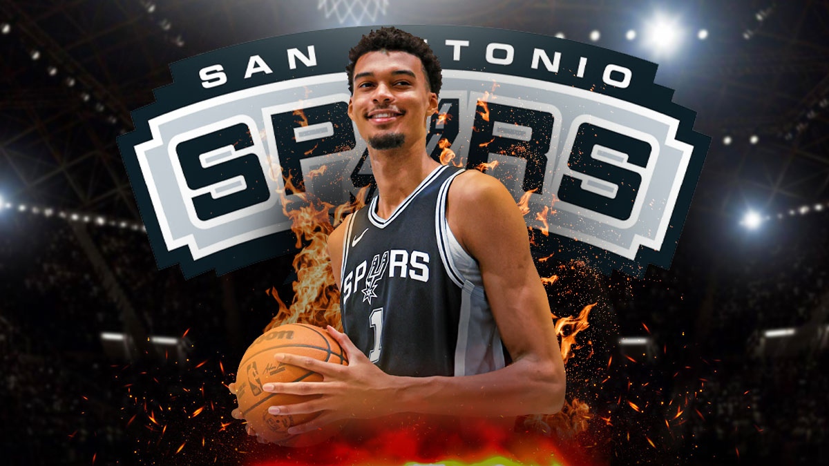 Spurs' Victor Wembanyama looks at Rockets players