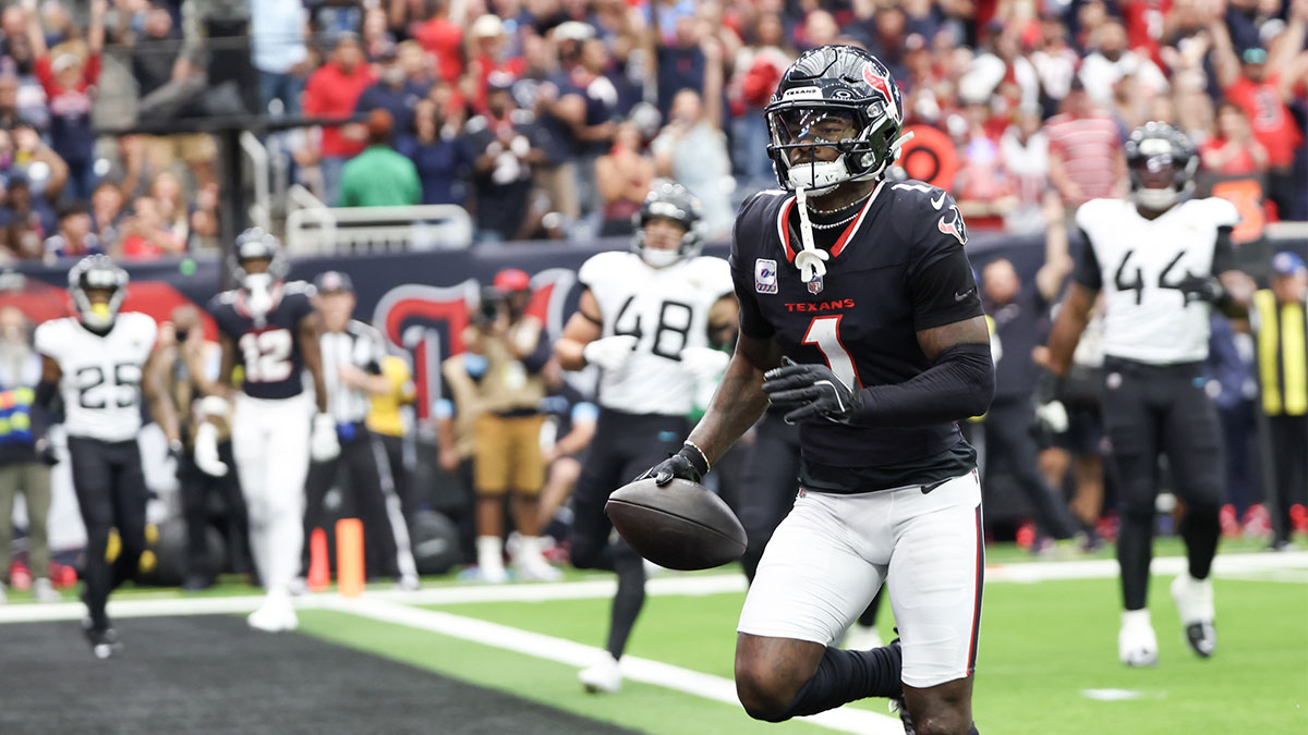 Sep 29, 2024; Houston, Texas, USA; Houston Texans wide receiver Stefon Diggs (1) scores against the Jacksonville Jaguars in the first quarter at NRG Stadium.