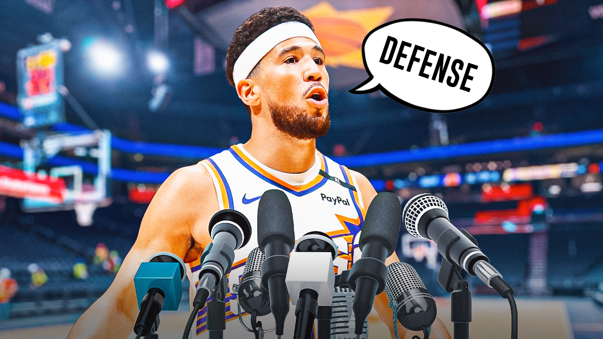 Phoenix Suns guard Devin Booker with a thought bubble that says "Defense" with microphones in front of him, and a background of the inside of the Suns arena.
