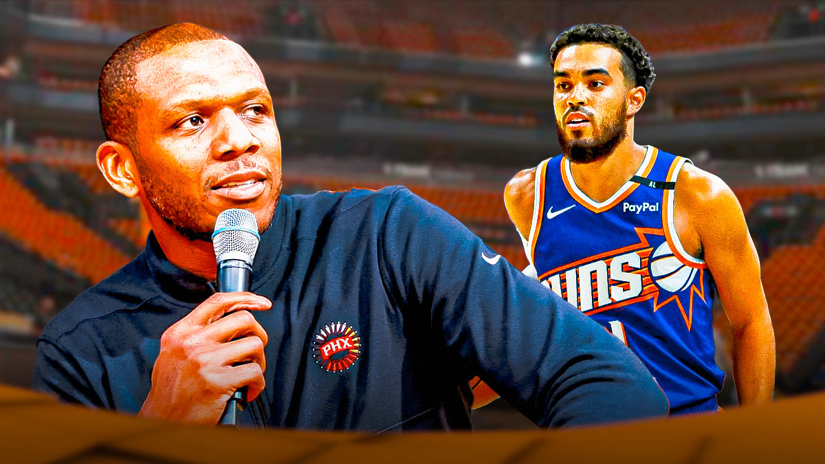 Phoenix Suns general manager James Jones with hearts on his eyes while looking at Suns point guard Tyus Jones. There's also a background of the inside of Footprint Center.