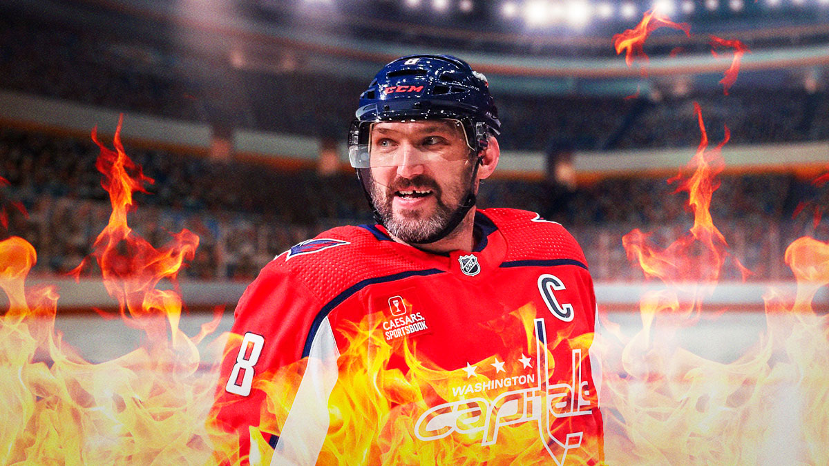 Alex Ovechkin with fire around him looking happy, Washington Capitals logo, hockey rink in background