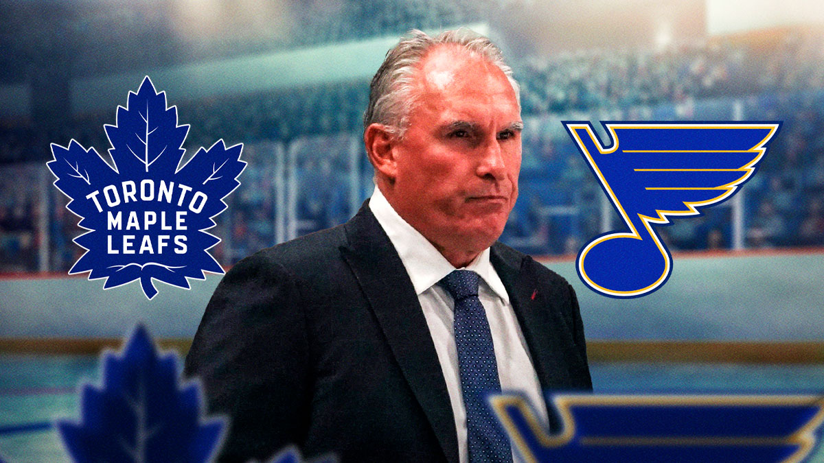 Craig Berube in middle looking stern, Toronto Maple Leafs and St. Louis Blues logo on either side, hockey rink in background
