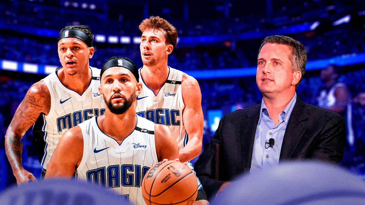 Bill Simmons looks across at Jalen Suggs, Franz Wagner and Paolo Banchero inside the KIA Center