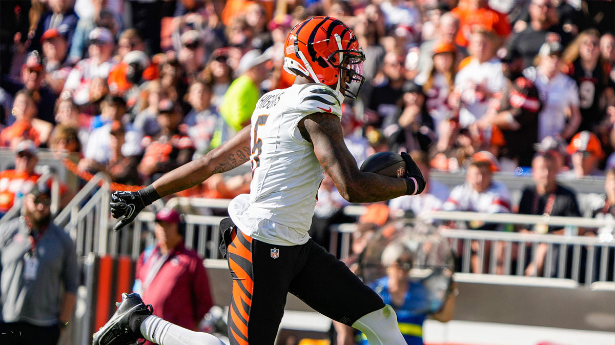Cincinnati Bengals wide receiver Tee Higgins (5) runs to the end zone for a touchdown over the Cleveland Browns during the NFL Week 7 game at Huntington Bank Field in Cleveland.
